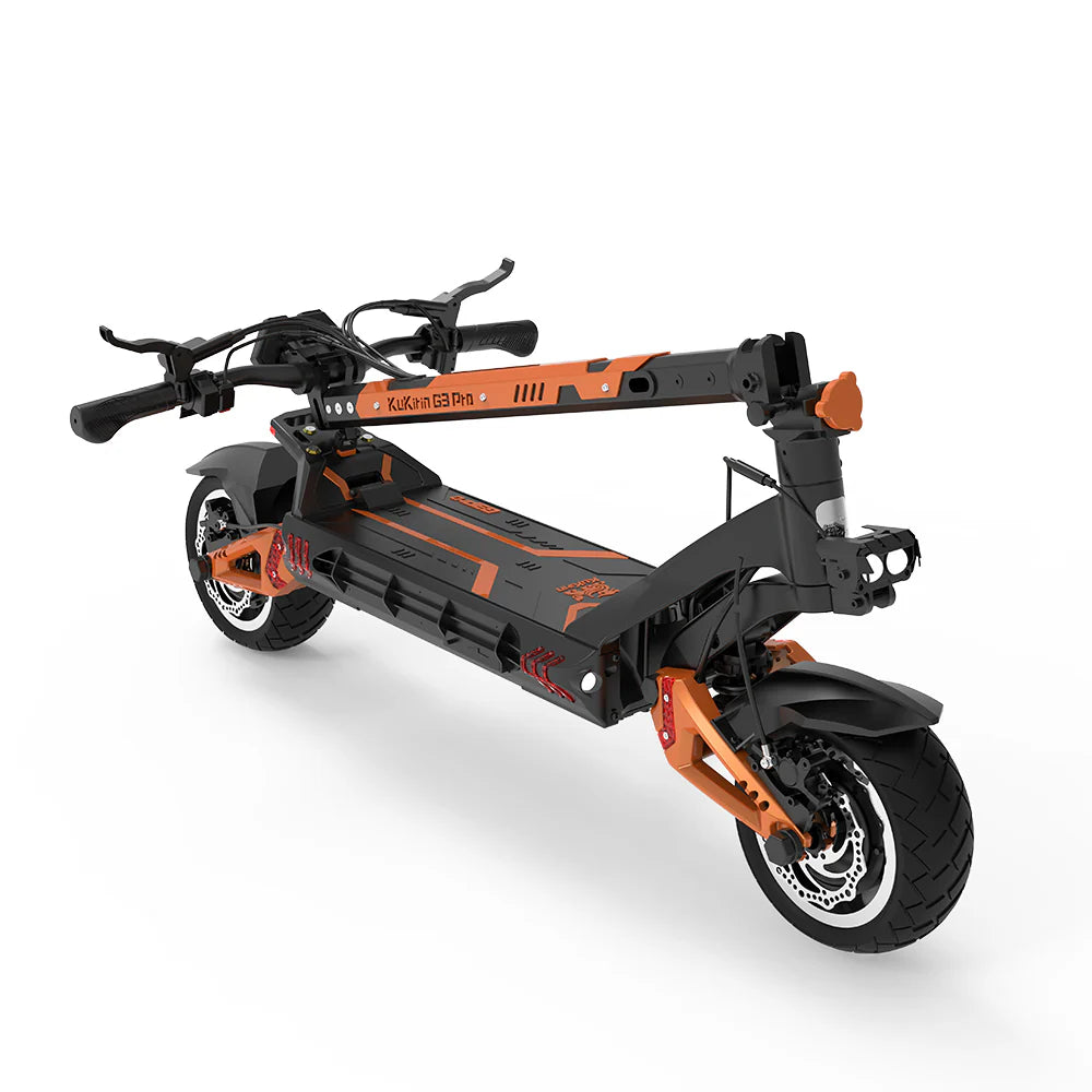The KuKirin G3 PRO 2x 1200W is a folded električni romobil in black and orange. It features thick tires, handlebars, visible suspension, and a litijska baterija 52V 23Ah. With its robust design for urban commuting, it offers a maksimalna brzina of 65 km/h.